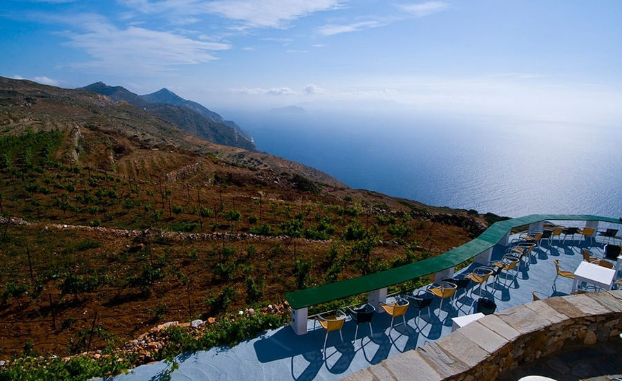 view of 'Manalis Winery' terrace in the background of blue sky and the sea